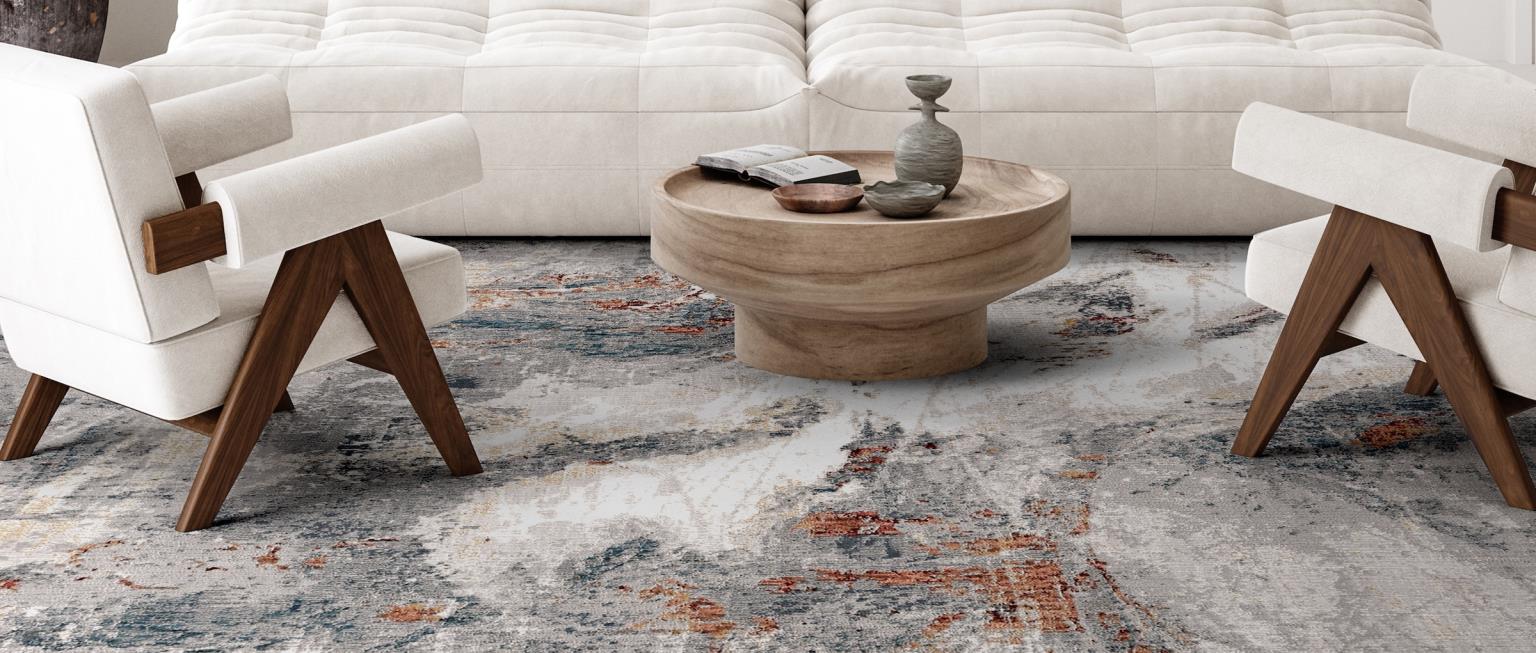blue swirl rug with white sofas