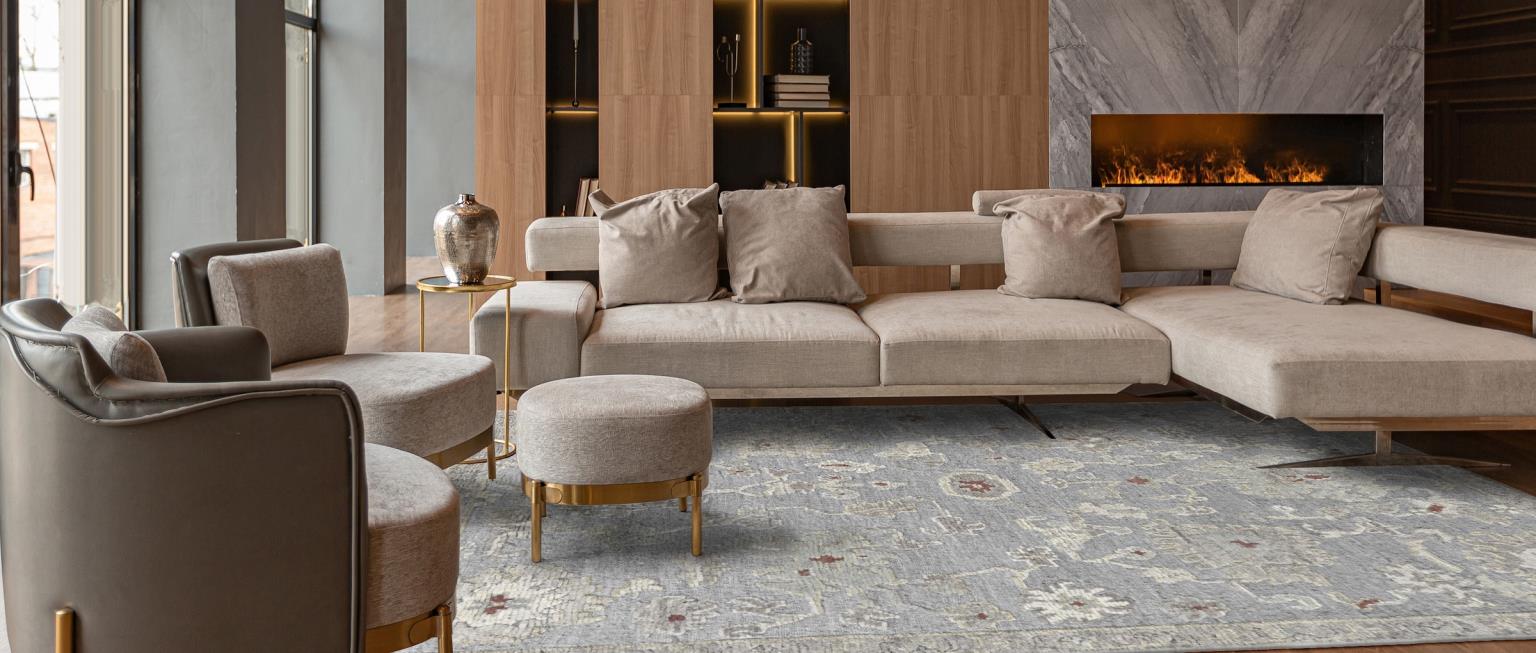 Modern liviing room with low pile muted blue traditonal floral rug