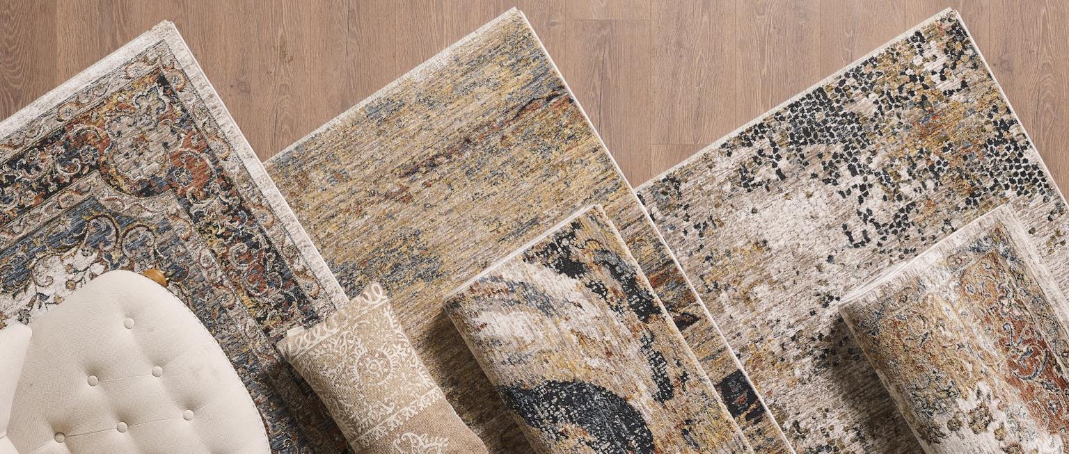 Modern liviing room with low pile muted blue traditonal floral rug