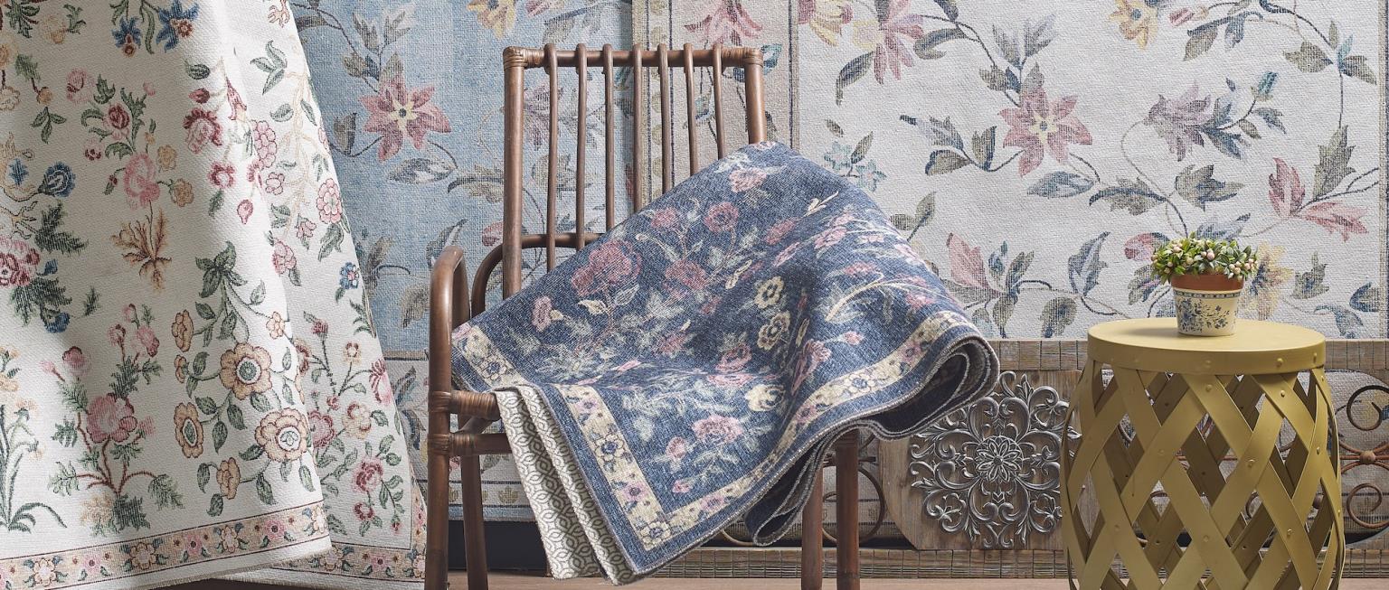 Midcentury leather sopha with low pile muted geometic rug